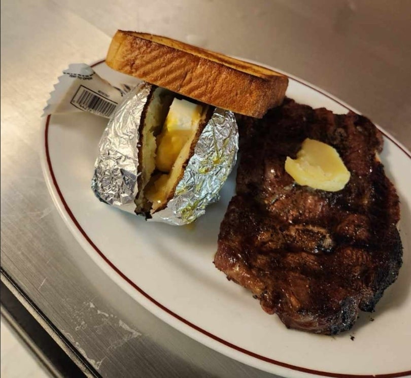 A perfectly cooked ribeye steak dinner at Dino's in Washington, IA